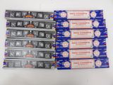 four packs of nag champa incense sitting on top of each other