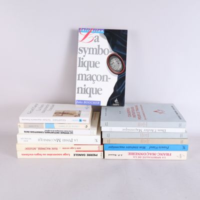 several books are stacked on top of each other on a table