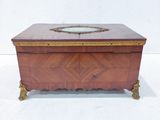 a wooden box with a mirror on top of it