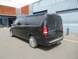 a black van that is parked in front of a building