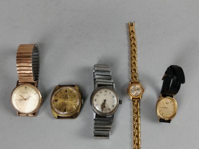 several different types of watches are displayed on a white surface