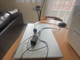 a laptop computer sitting on top of a wooden table