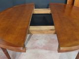 a wooden table with a drawer underneath it
