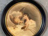 une photo représentant une femme et un oiseau accrochée au mur