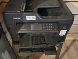 a printer that is sitting on top of a table