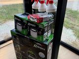a stack of boxes with spray bottles on top of them