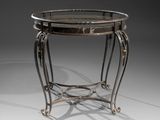 a round table with a glass top and metal legs