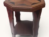 a small wooden table with a geometric design on it
