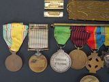 many medals and medals on display on a black surface