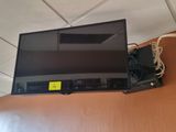 a flat screen tv mounted on a wall in a room