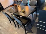 a table with chairs and a basket on top of it