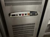 a silver oven with a metal door and a black handle