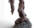 statue of a man holding a dead animal on a wooden base