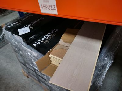 a pile of cardboard sitting on top of a pallet