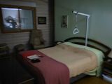 a bed in a room with a wooden headboard