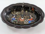 a black bowl with a picture of people on it