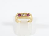 a close up of a gold ring with two stones on it