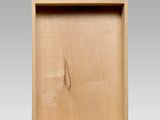 a close up of a wooden box with a hole in it