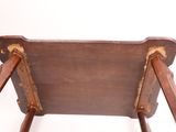 a wooden chair with two wooden legs and a wooden seat