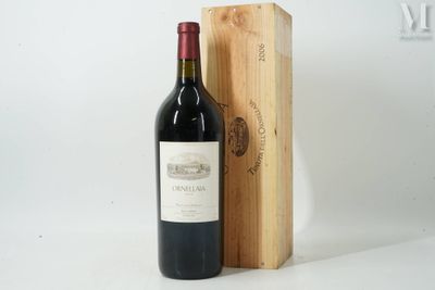 a bottle of wine sitting next to a wooden box
