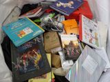 a pile of books and dvds in a bag