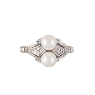 an image of a pearl and diamond ring on a white background