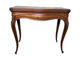 a wooden table with a curved top and legs