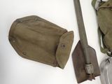 two shovels and a bag on the table