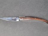 a knife that is laying on top of a table