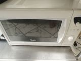 a microwave sitting on top of a counter in a kitchen