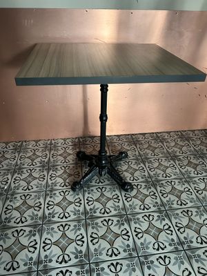 a table that is sitting on top of a tile floor