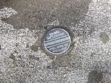 a close up of a street sign on a cement surface