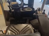 an image of a tractor with a seat and steering
