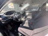 the interior of a car with a steering wheel and a dashboard