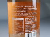 a close up of a bottle of alcohol on a table