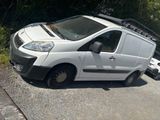 a white van that is parked on the side of the road