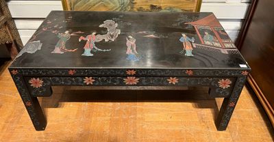 an image of a black table with a painting on it