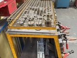 a machine that is working on a piece of metal