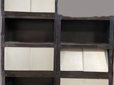 a black and white bookcase with four shelves