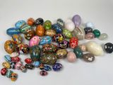 a pile of colorful glass beads on a white surface