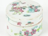 a small white box with a floral design on it
