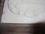 a sculpture of a cat that is on a table