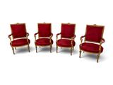 three red chairs with gold trim and red velvet upholstered