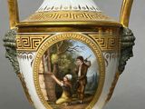a white and gold vase with a painting on it