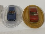 three toy cars that are sitting on top of each other