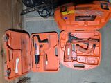 an orange tool case with tools in it sitting on the floor