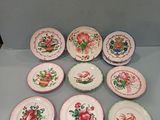 nine plates with different designs on them sitting on a table