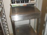 a metal table with a bunch of bottles on it