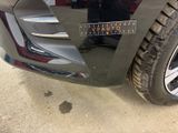 a close up of a car ' s bumper with a sticker on it