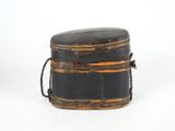 a black box with a rope around it on a white surface